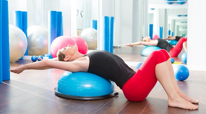 How can I work out my upper back using a stability ball at home